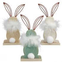Article Lapin décoratif lapins en bois avec plumes décoration de Pâques H17,5cm 3 pcs