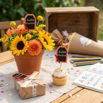 Article Bouchon décoratif rentrée scolaire «Enfin l'écolier» bois 7×5,5cm 16 pièces