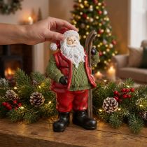 Article Figurine décorative du Père Noël avec ski peinte 14 × 10,5 × 24,5 cm