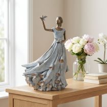 Article Figurine représentant une femme avec un oiseau. Sculpture décorative au design intemporel et raffiné. 41 cm