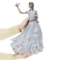 Article Figurine représentant une femme avec un oiseau. Sculpture décorative au design intemporel et raffiné. 41 cm