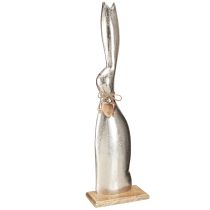 Article Lapin décoratif argenté sur socle en bois – Elégante figurine de Pâques avec pendentif coeur H60cm