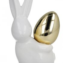 Article Lapins avec oeuf d&#39;or, lapins en céramique pour Pâques blanc noble, doré H13cm 2pcs