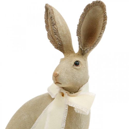 Floristik24 Lapin de Pâques assis avec noeud polyrésine décoration de table Pâques H30cm